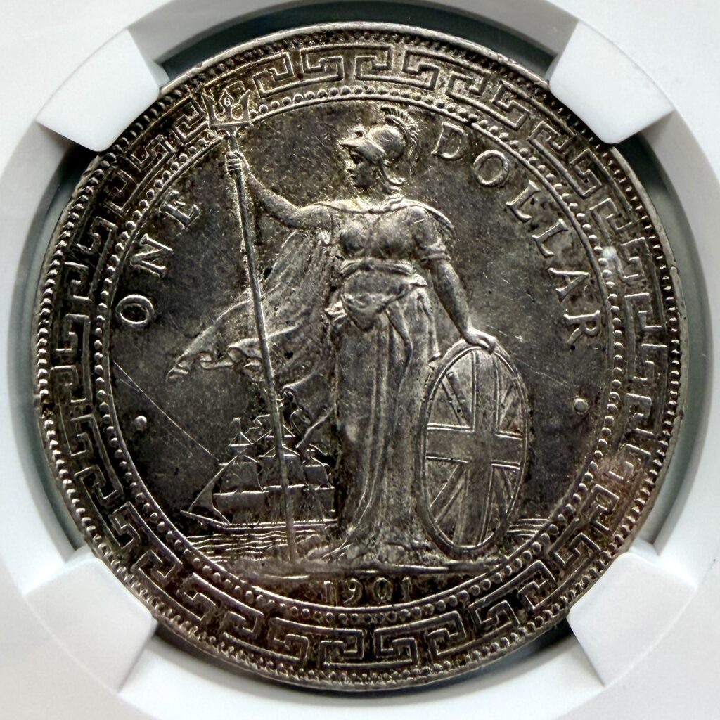 Close-up of the Britannia side of a 1901-B Great Britain Trade Dollar, showing Britannia with trident, shield, and merchant ship.