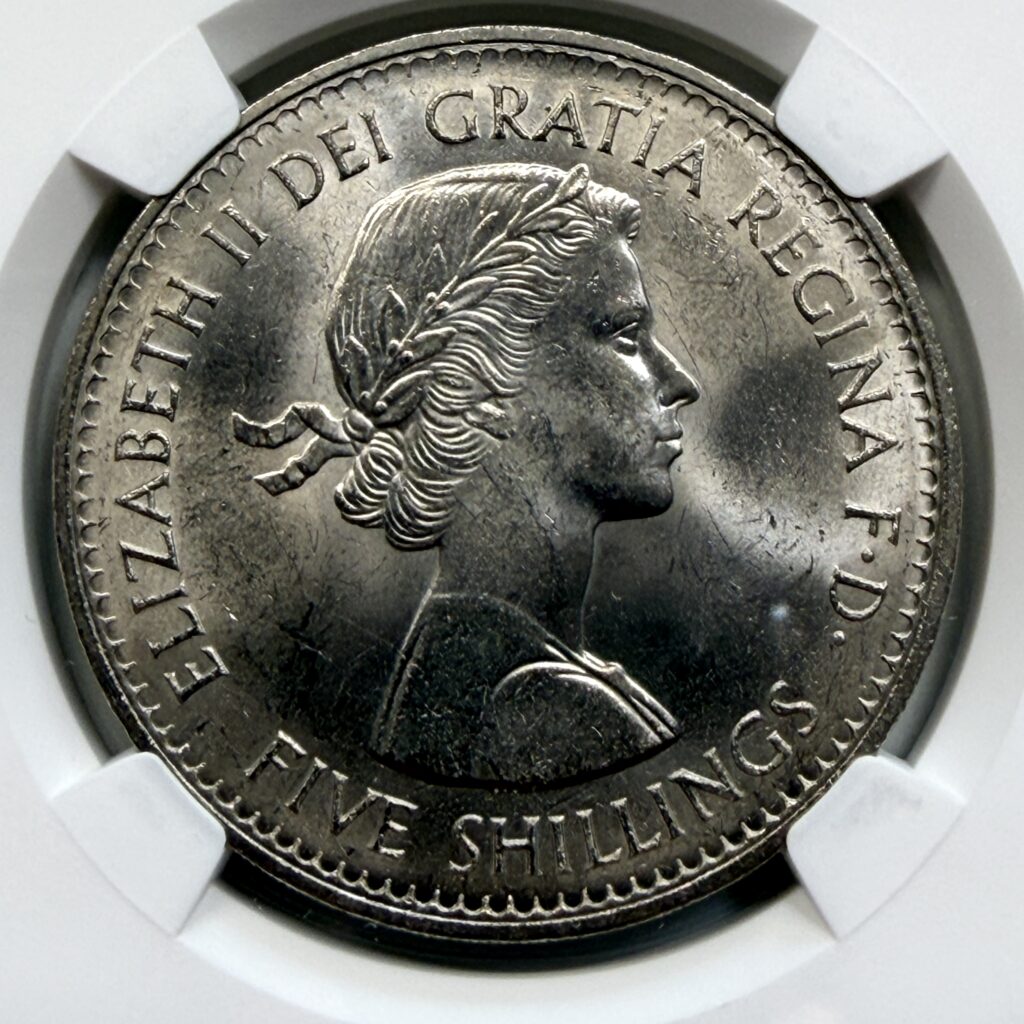 Close-up of the obverse of the 1960 British Exhibition Crown showing the young portrait of Queen Elizabeth II.