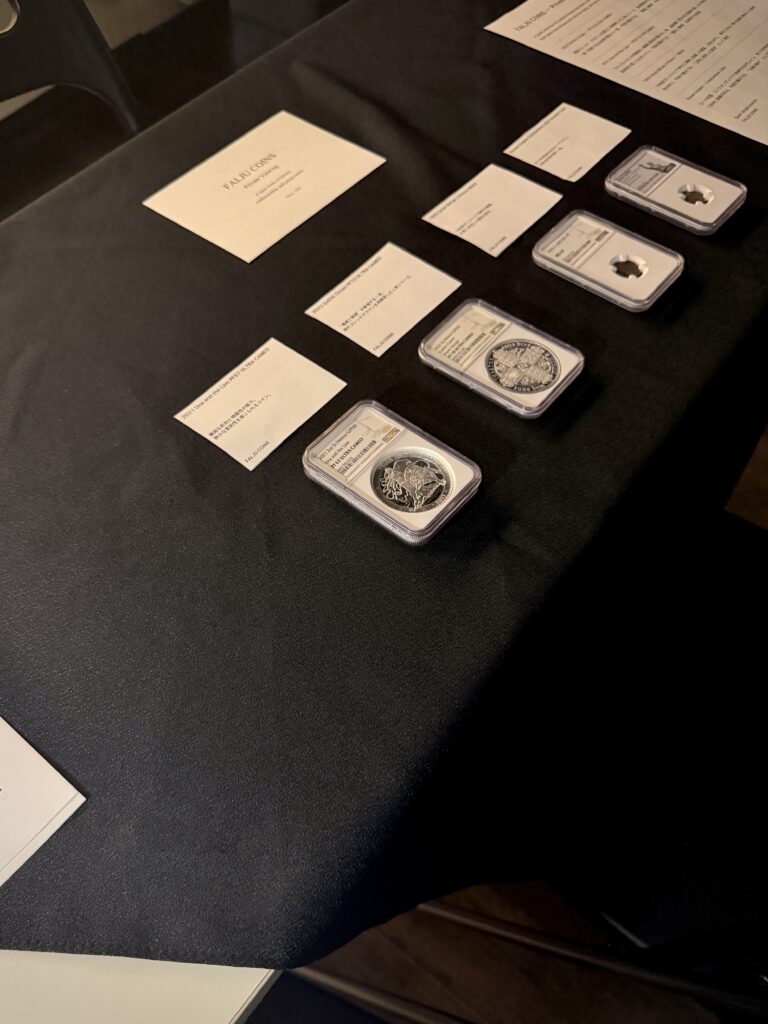 A private viewing in Tokyo featuring Una and the Lion, Gothic Crown, an 1855 Great Britain Four Pence, and a Roman bronze coin, arranged to explore continuity across different historical periods.
